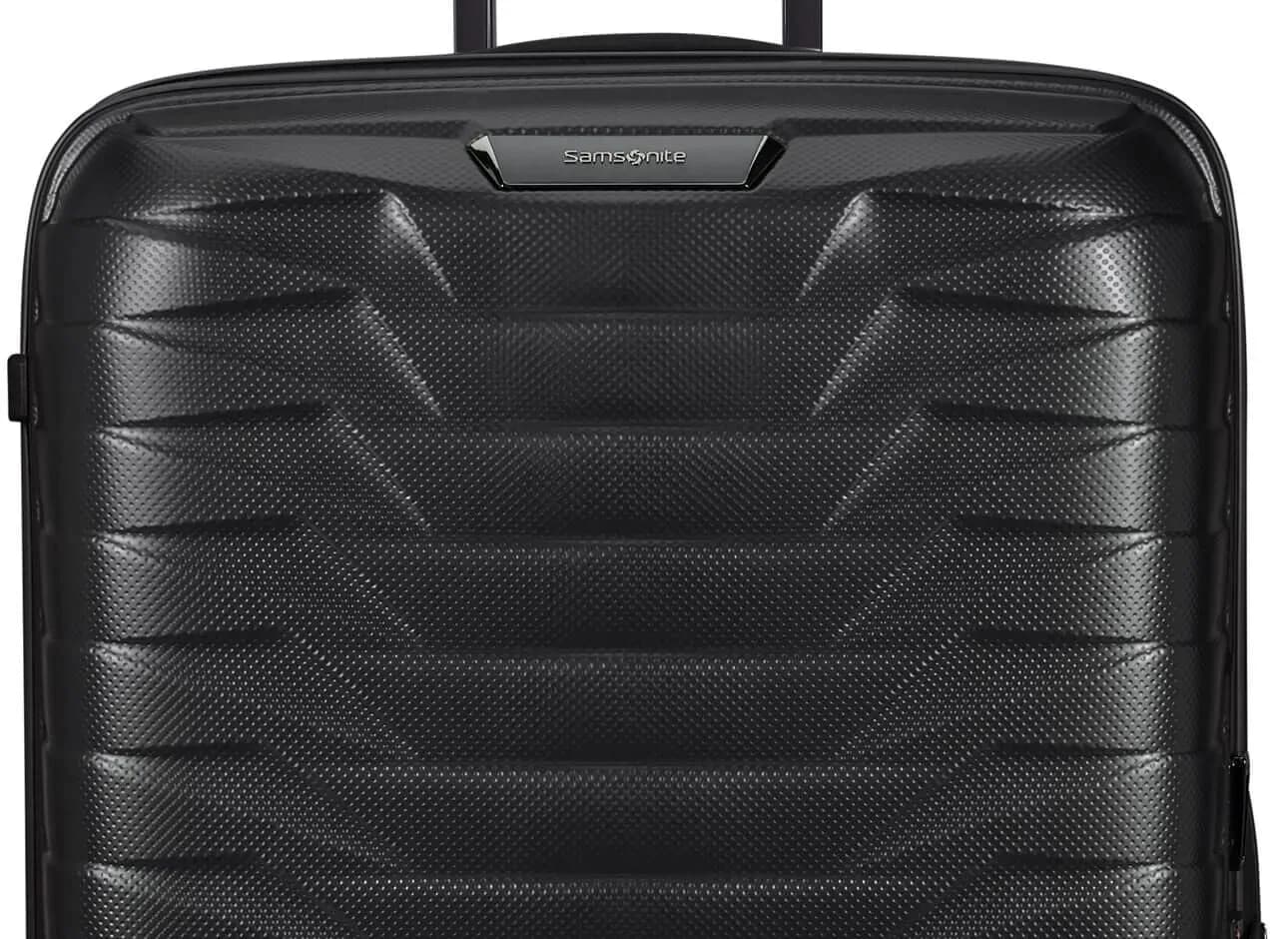 Official Samsonite Proxis Matt Graphite front-shell detail with the Samsonite badge and pull handle